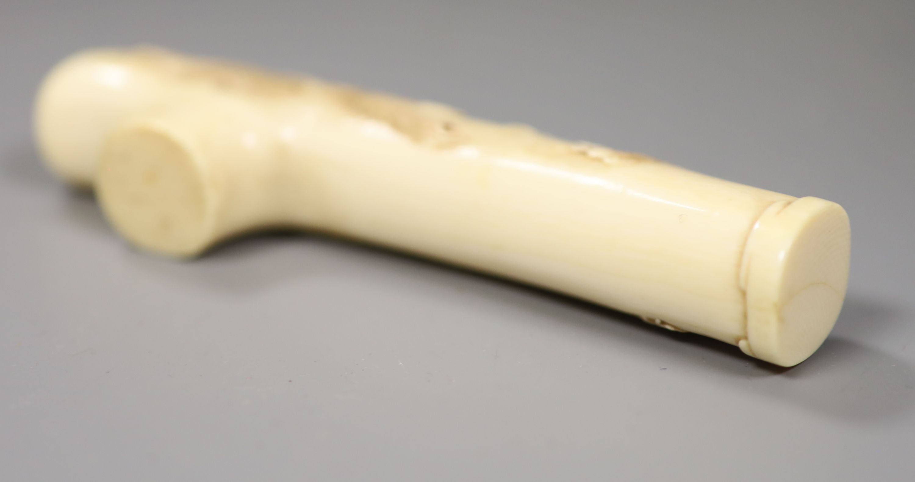 A Japanese Meiji period carved ivory cane handle